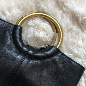 J. Crew black leather gold bracelet bucket bag with adjustable shoulder strap